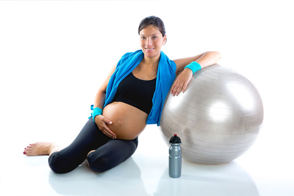 Φωτογραφία Γυναίκας γυμναστική στην εγκυμοσύνη